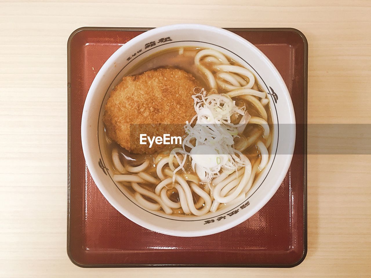 Noodle soup with cutlet on tray