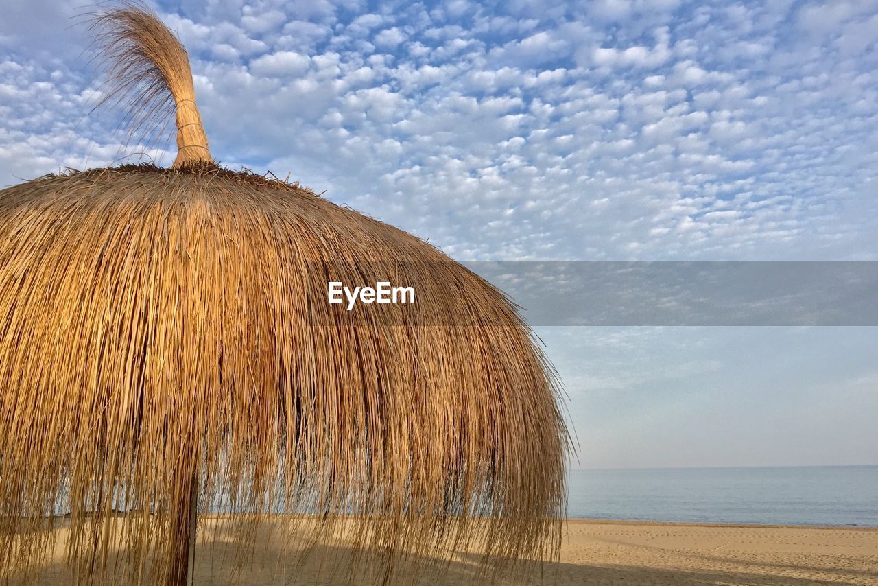 View of calm sea against cloudy sky