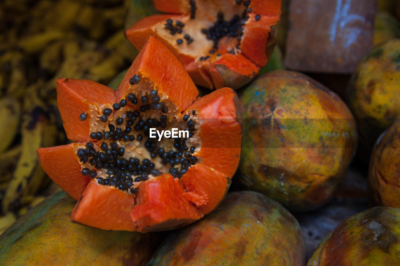 Close-up of papayas for sale at market stall