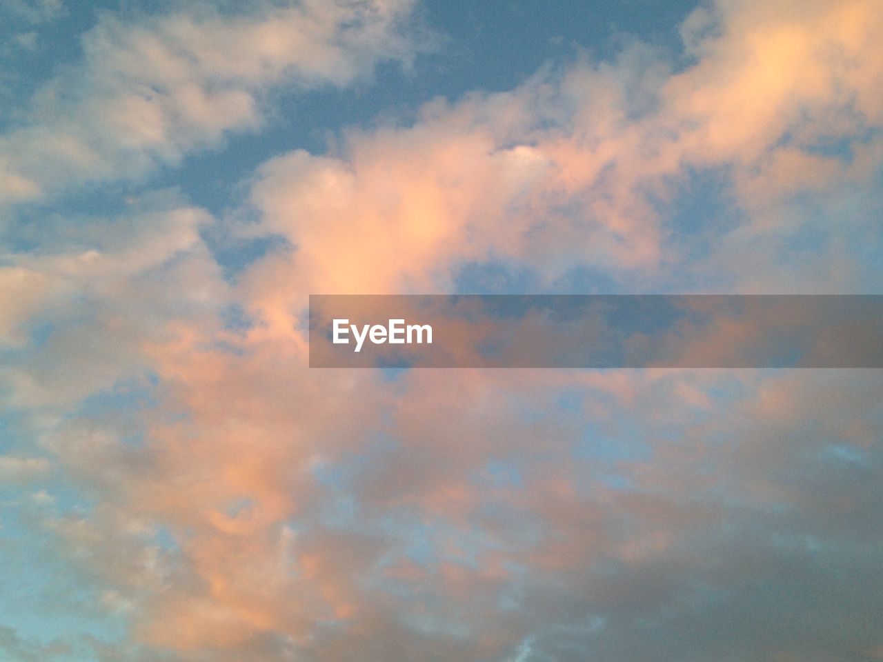 Low angle view of cloudy sky during sunset