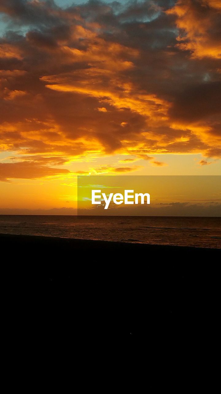 Silhouette of beach at sunset