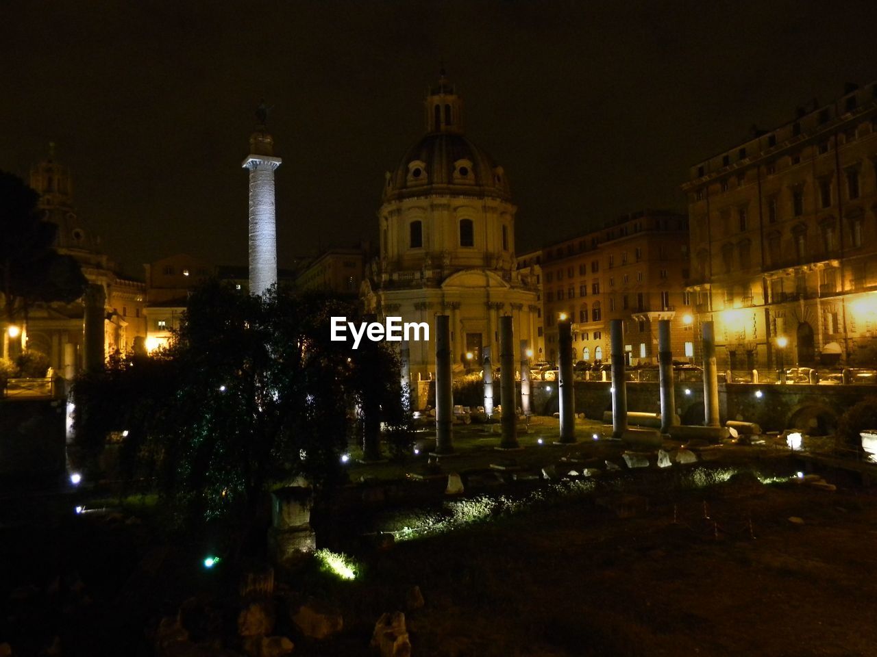 Trajan column by santissimo nome di maria al foro traiano church at night