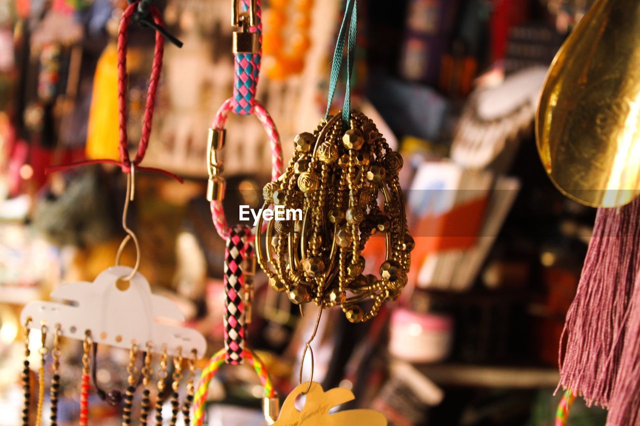 Various bracelets hanging for sale at market