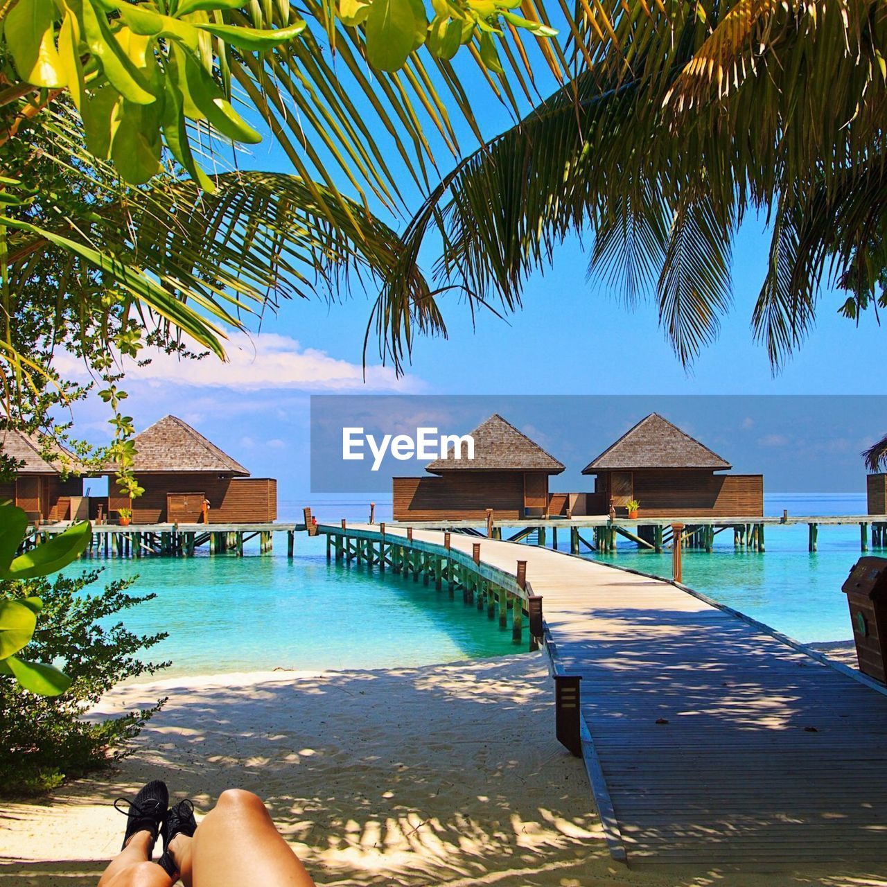 View of swimming pool by sea against sky