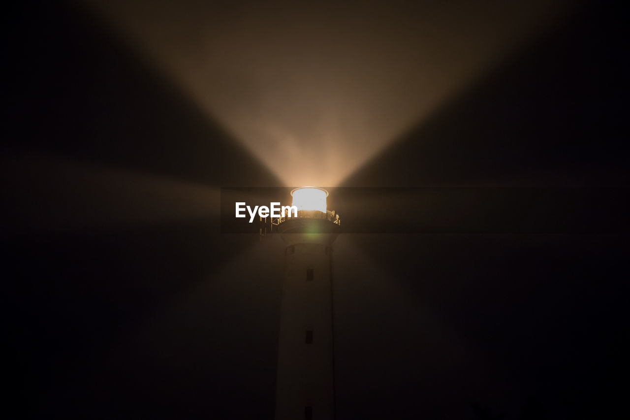 LOW ANGLE VIEW OF ILLUMINATED STREET LIGHT AGAINST SKY