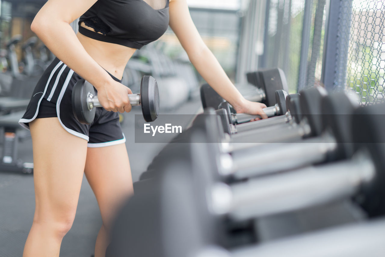 Young woman exercising at gym