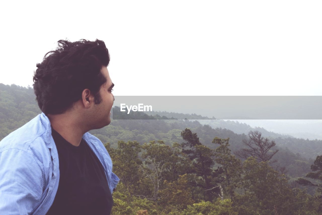 Man on landscape against sky