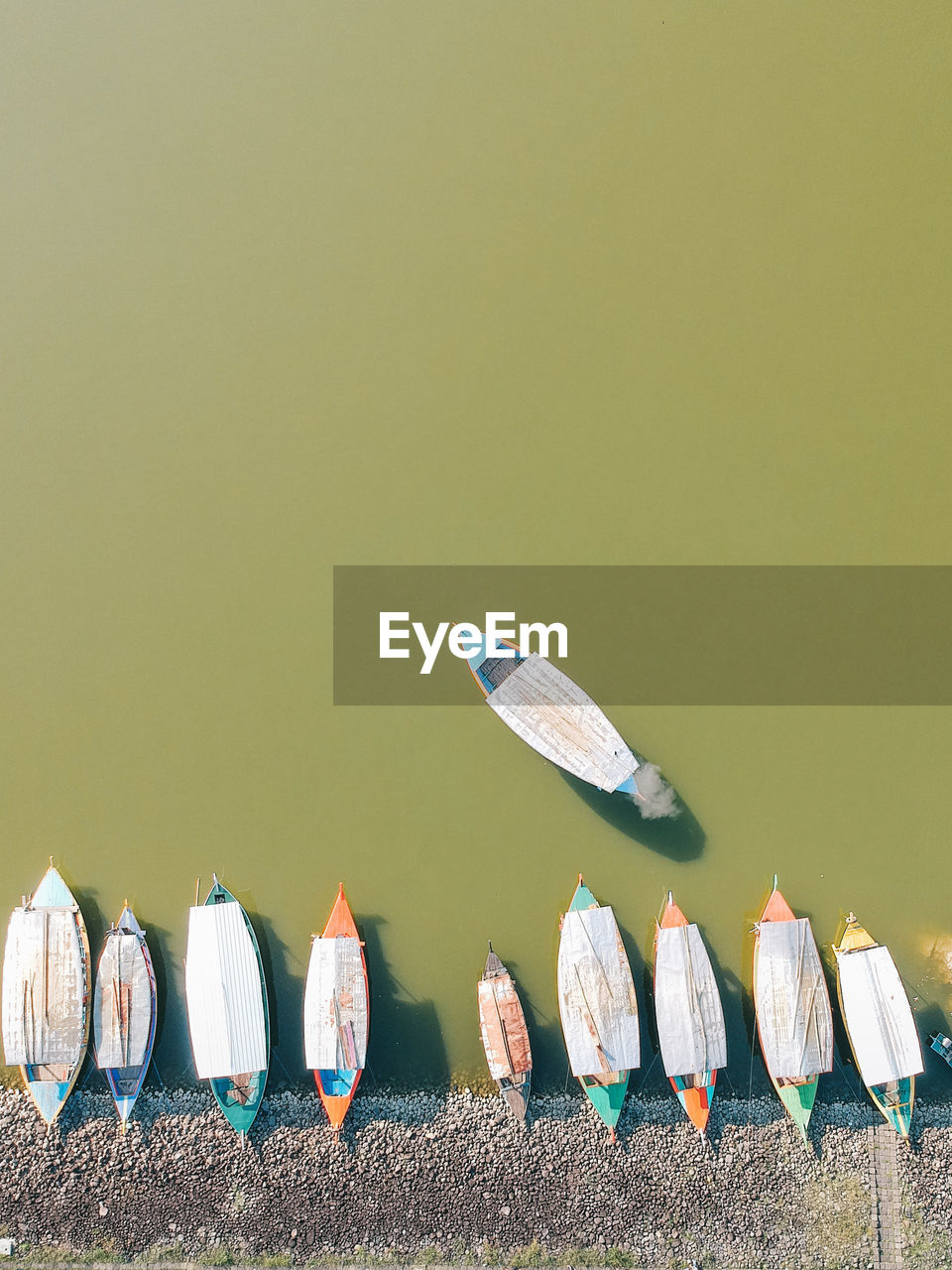 Row of boat docking beside the lake