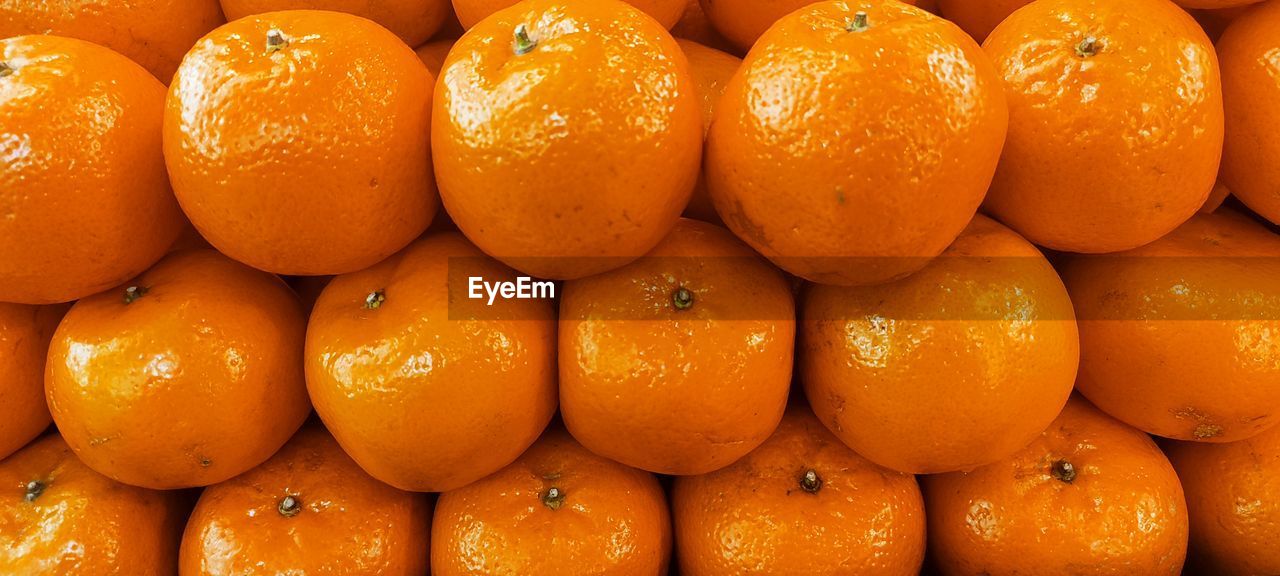 food and drink, food, healthy eating, fruit, orange color, freshness, clementine, tangerine, wellbeing, citrus, citrus fruit, large group of objects, produce, plant, orange, abundance, backgrounds, bitter orange, full frame, calamondin, no people, close-up, grapefruit, organic, vegetarian food, still life, market, retail, repetition, for sale, ripe
