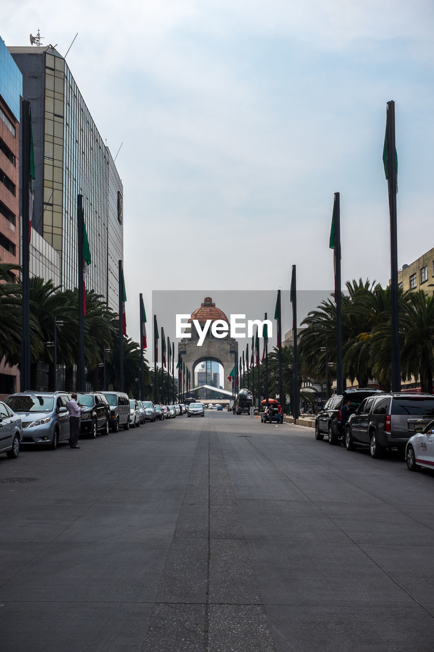 VIEW OF CITY STREET AGAINST SKY