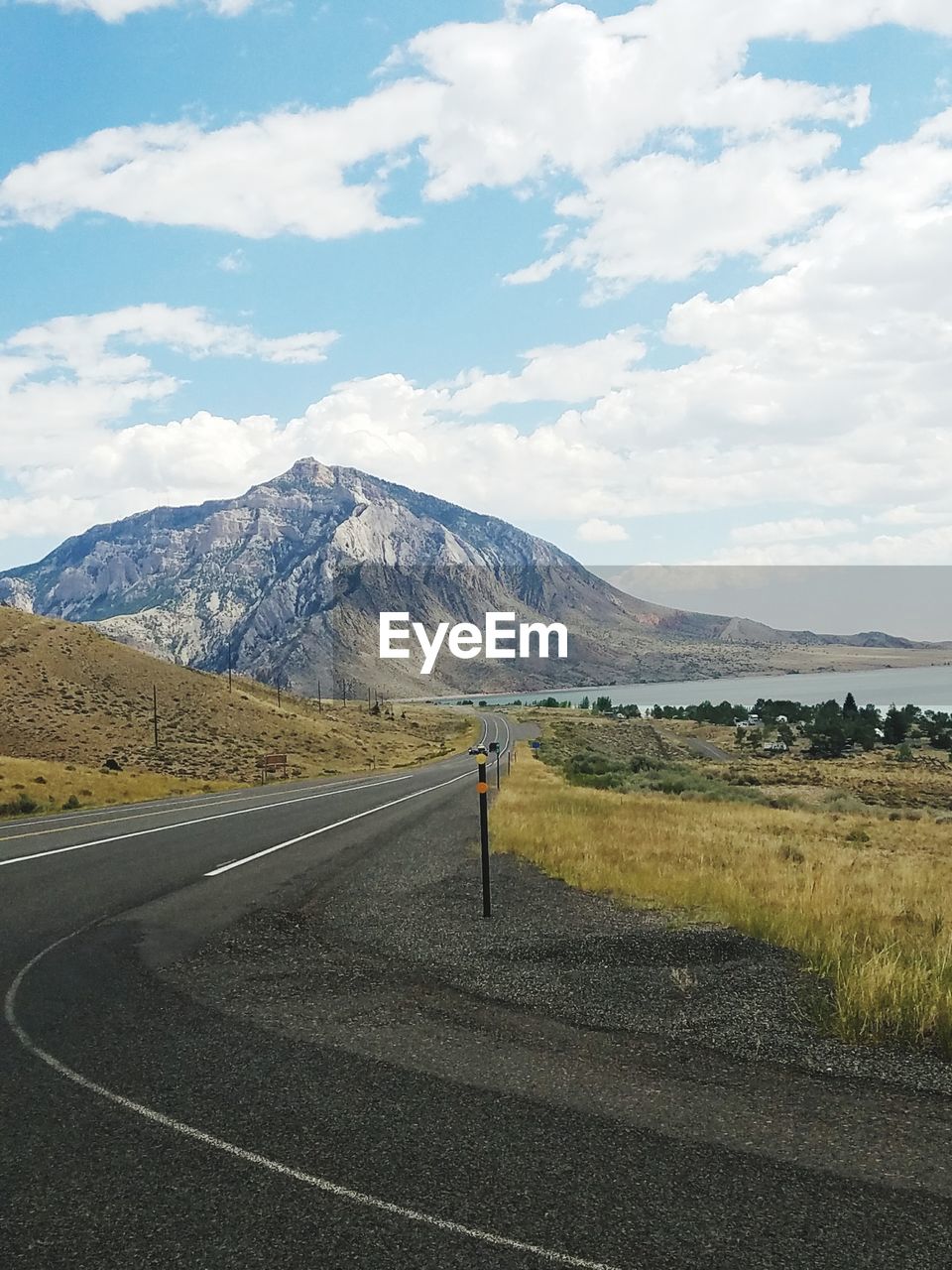 VIEW OF ROAD WITH MOUNTAIN IN BACKGROUND