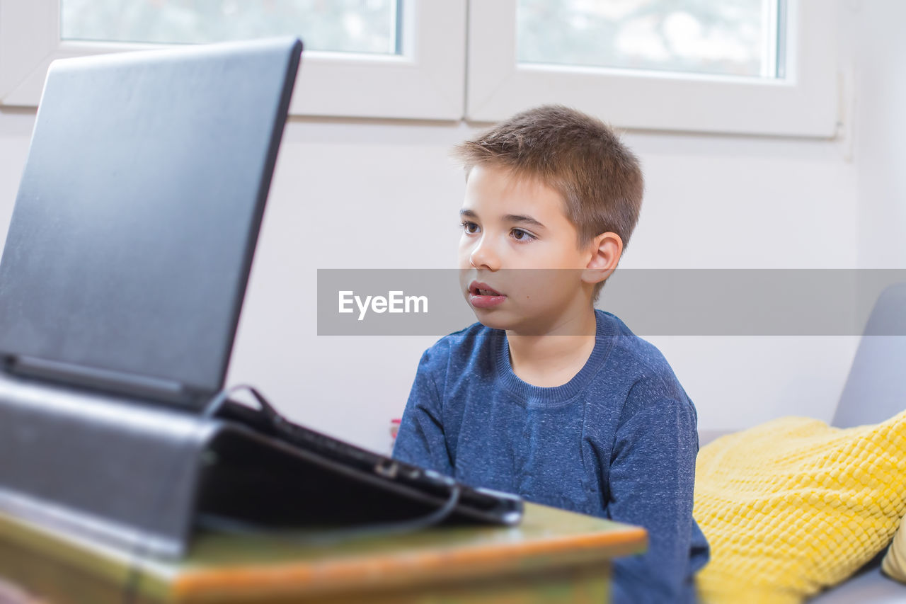 BOY LOOKING AT CAMERA