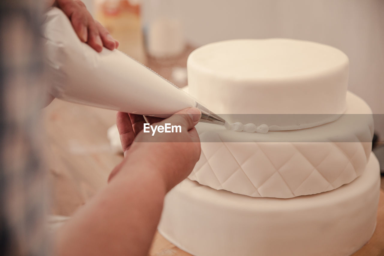 Close-up of preparing cake