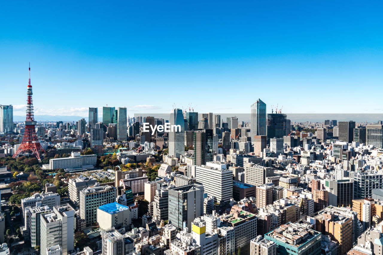 Aerial view of modern buildings in city against clear sky