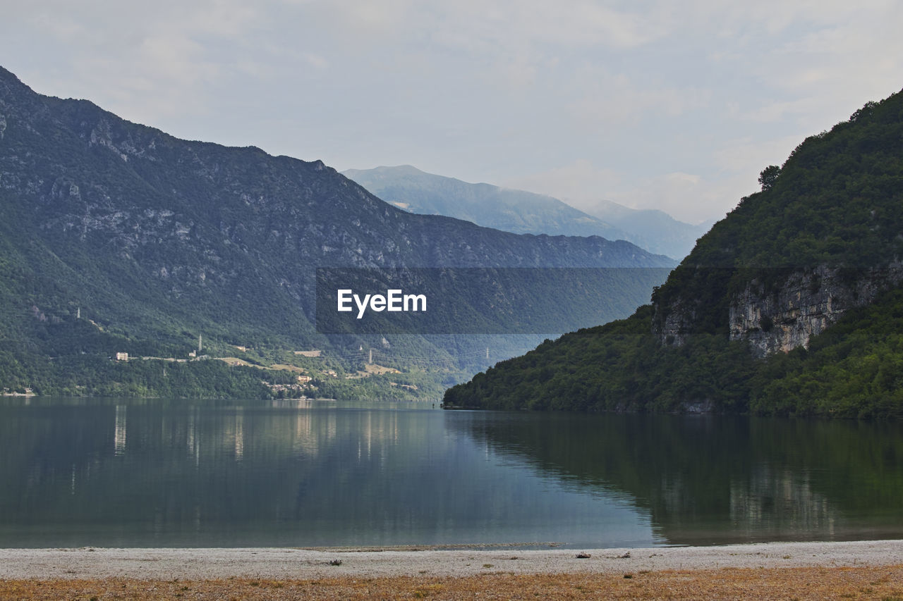 Scenic view of lake and mountains against sky