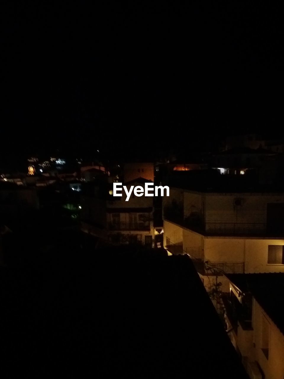 HIGH ANGLE VIEW OF ILLUMINATED BUILDINGS AGAINST SKY