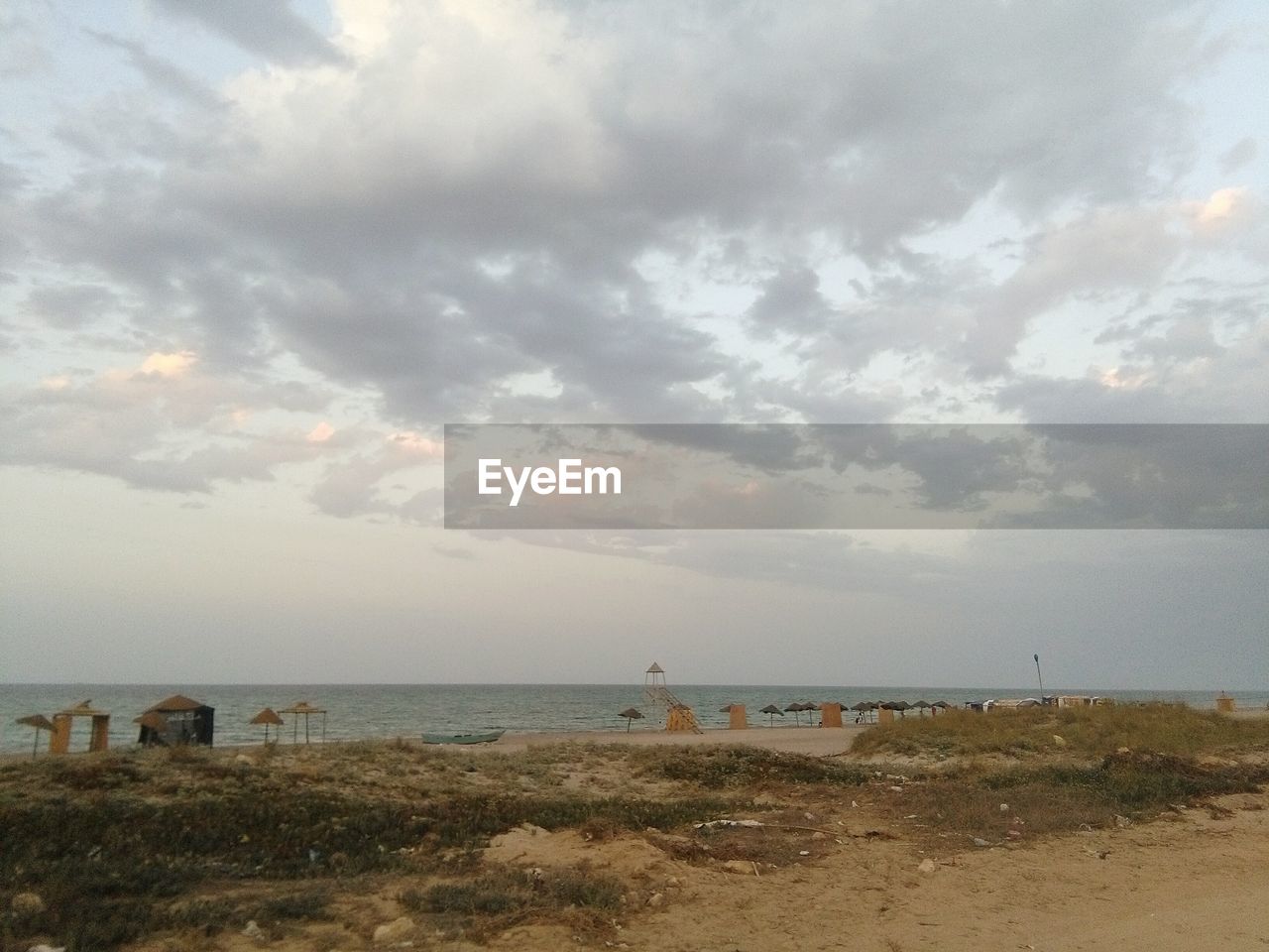 VIEW OF SEA AGAINST CLOUDY SKY