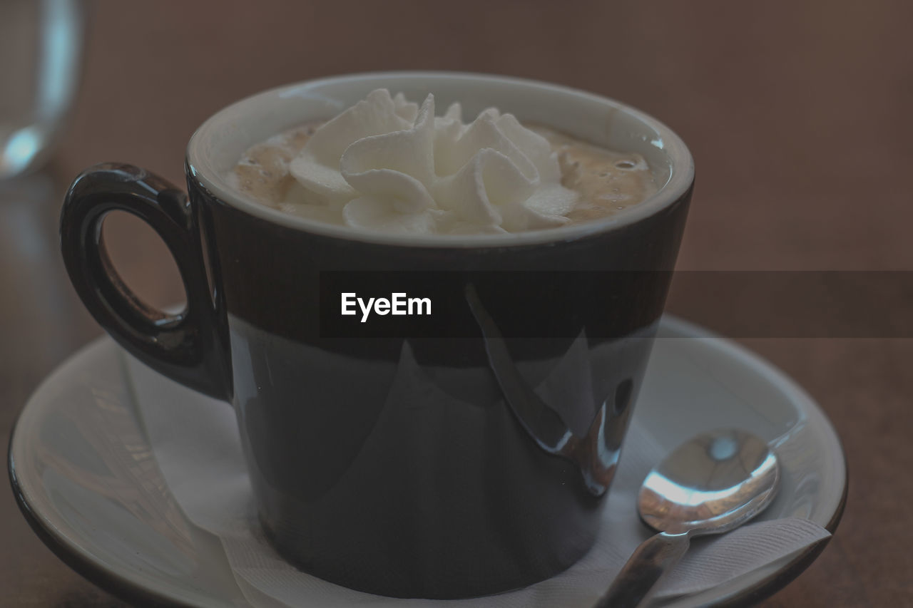 CLOSE-UP OF CUP OF COFFEE WITH TEA