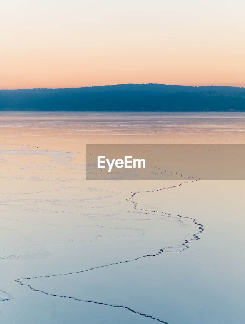 Scenic view of sea against clear sky during sunset