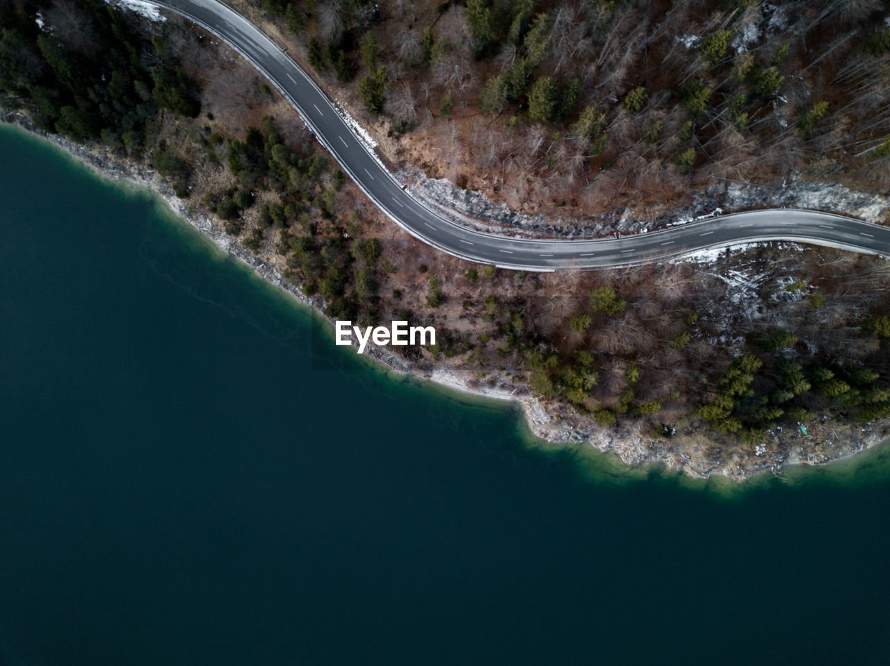 Aerial view of road by lake