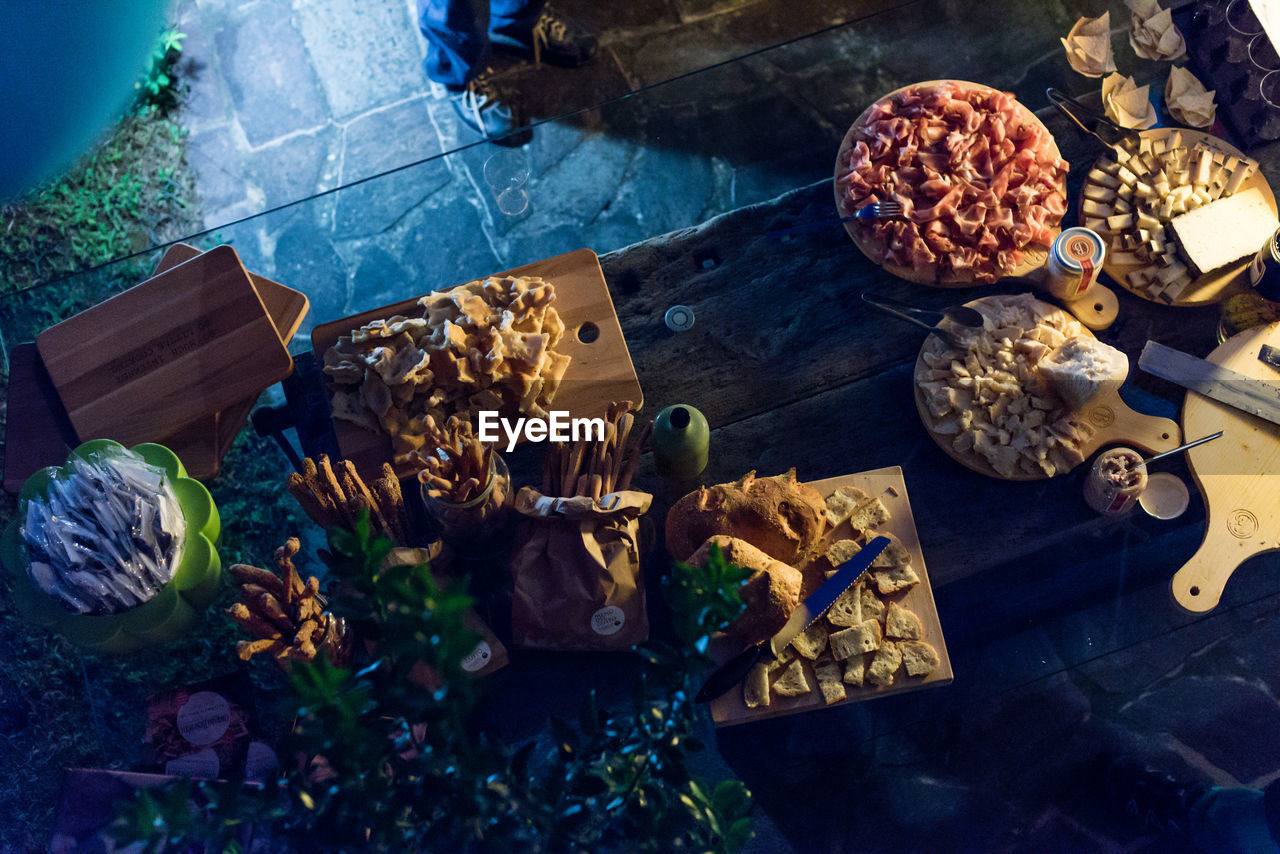 High angle view of various food on table during party