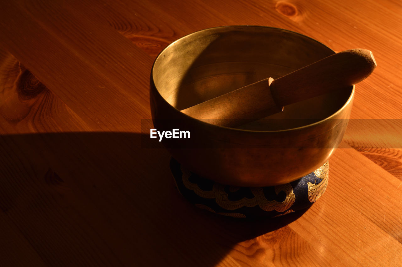 Close-up of tibetan music bowl on table