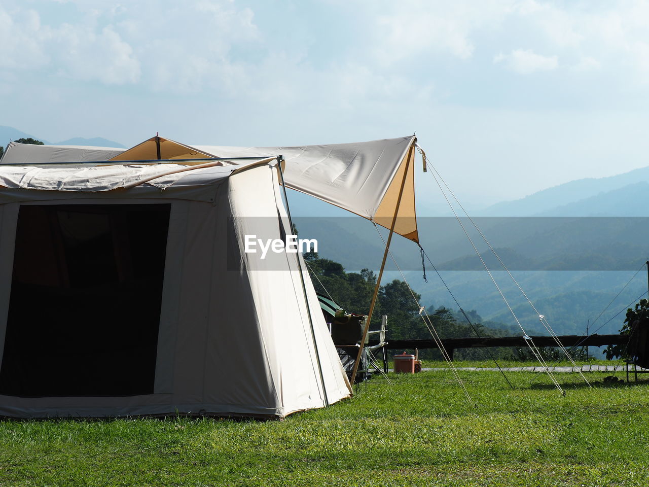 tent, grass, sky, nature, plant, environment, mountain, camping, land, architecture, cloud, day, no people, landscape, built structure, outdoors, field, beauty in nature, tranquility, sunlight, building exterior, scenics - nature, building