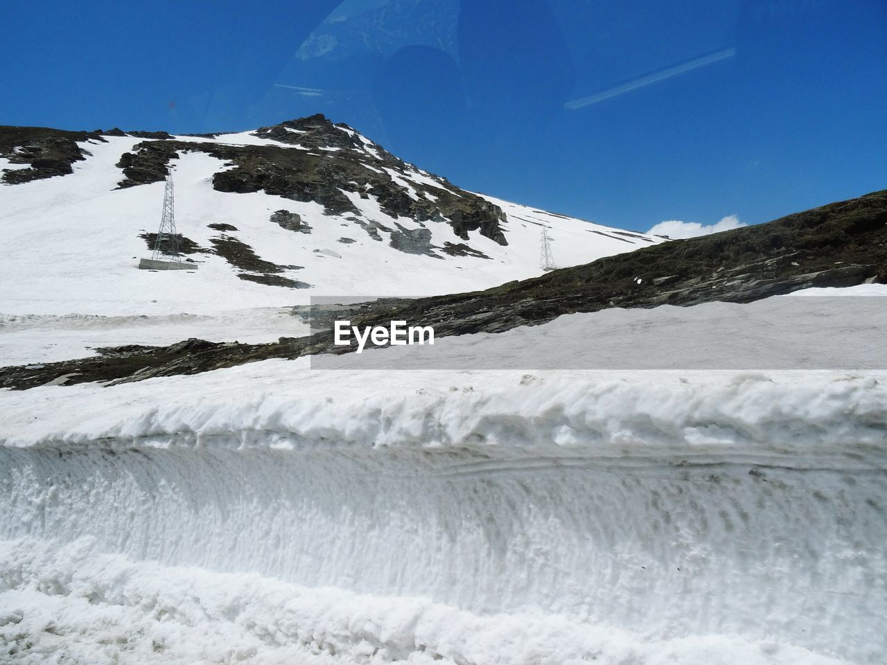 Scenic view of snowcapped mountains against sky during winter