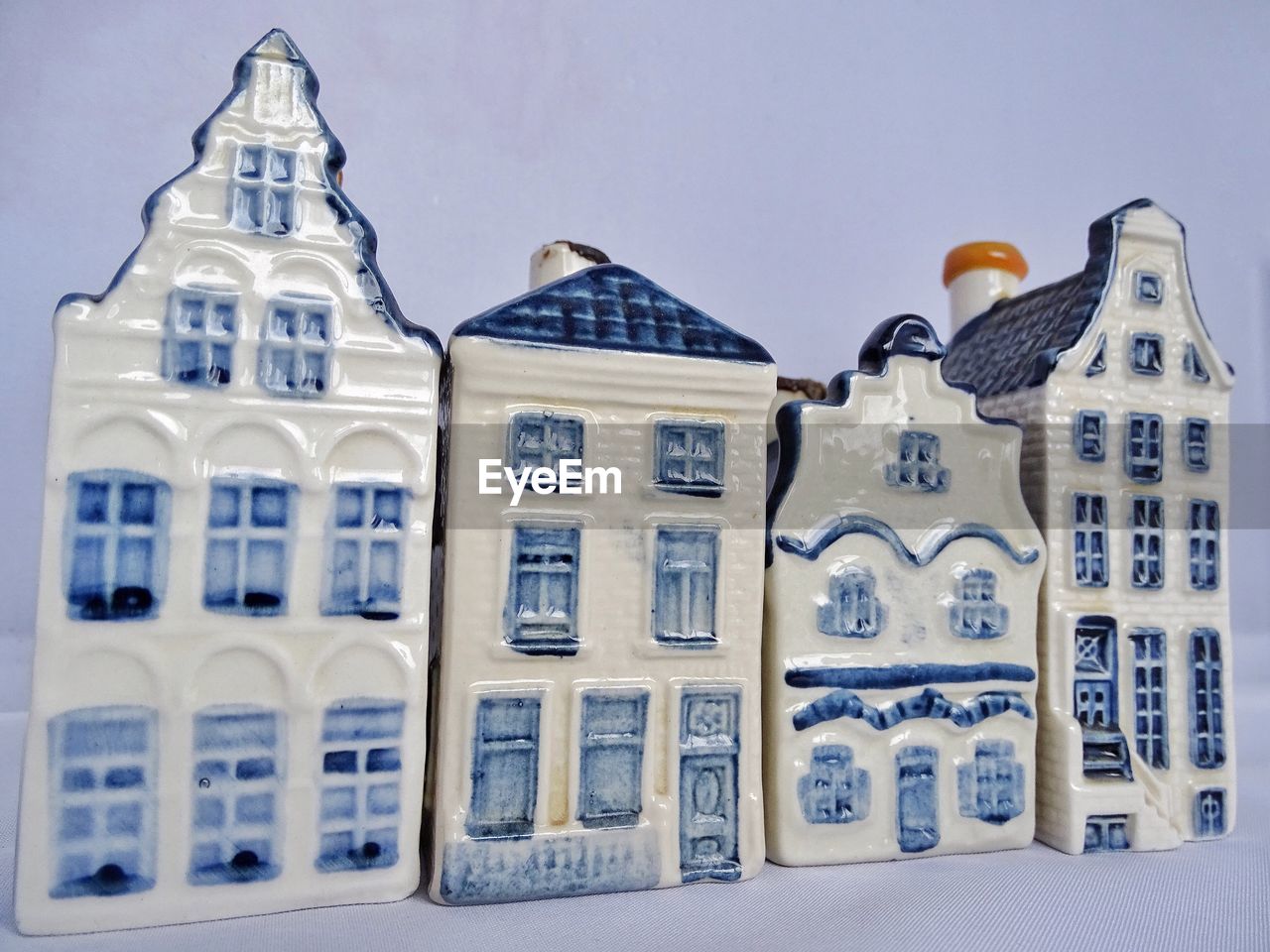 Close-up of toy house against white background