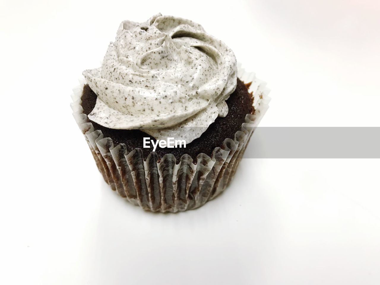Close-up of cupcake on white background