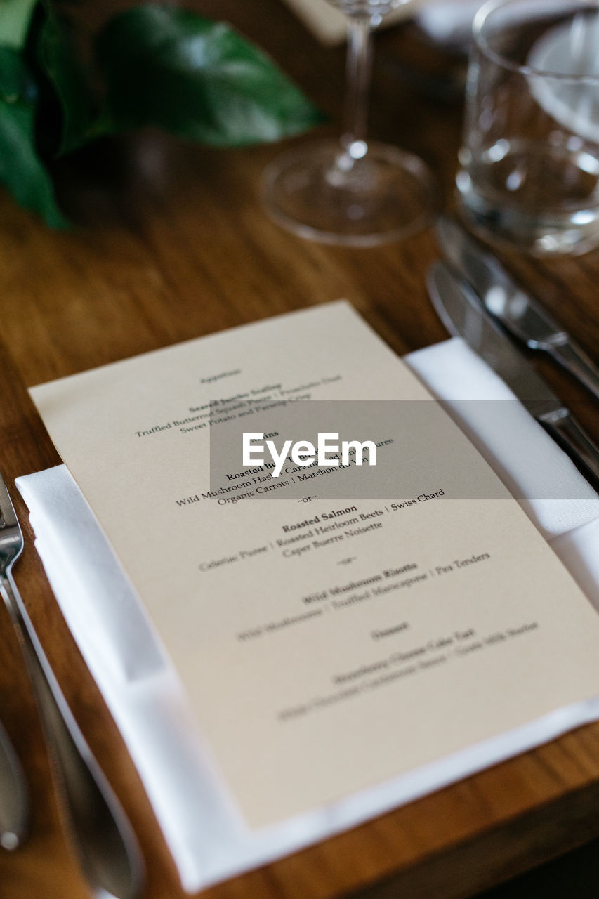 High angle view of menu card on table at restaurant