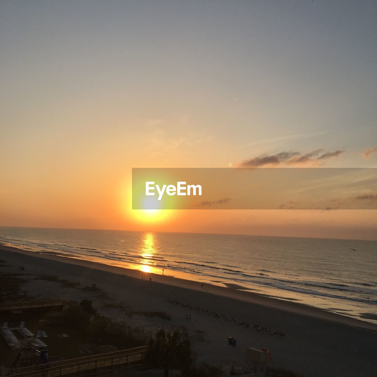 SCENIC VIEW OF SEA AT SUNSET