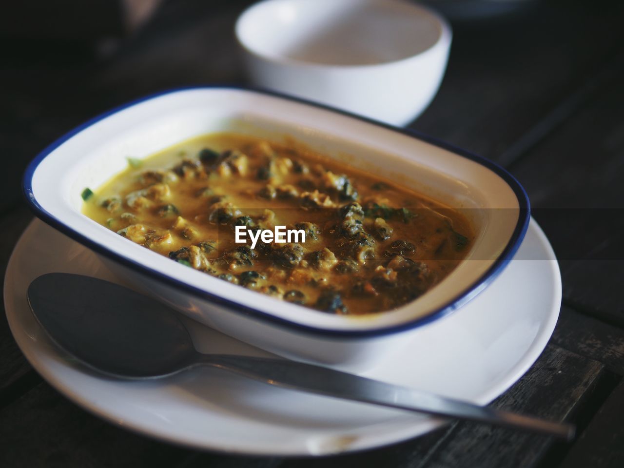 Close-up of food in bowl on plate over table