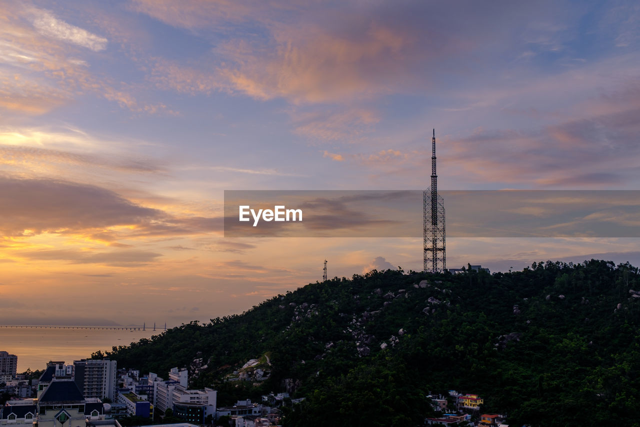 BUILDINGS AGAINST SKY DURING SUNSET