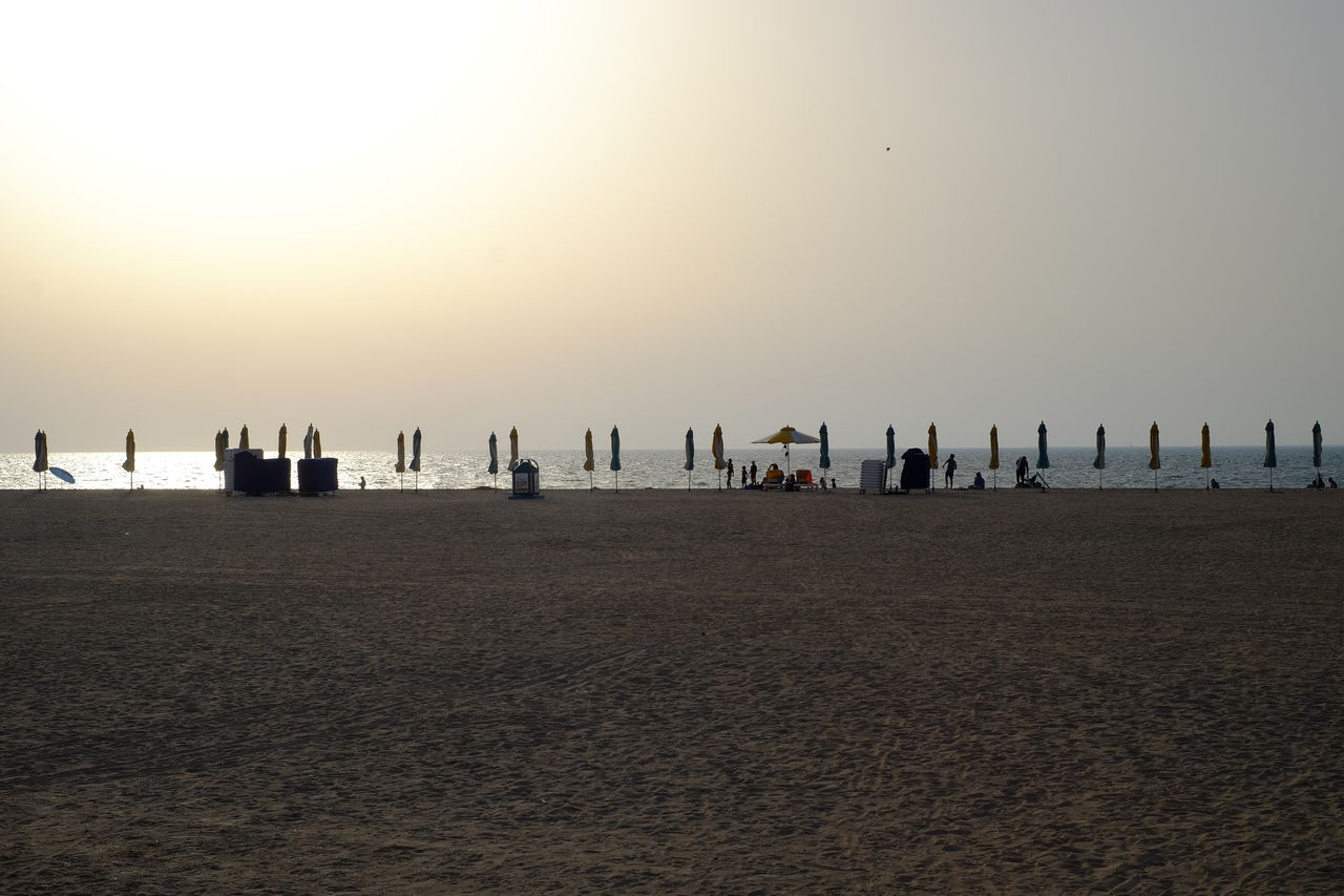 Scenic view of beach against sky during sunset