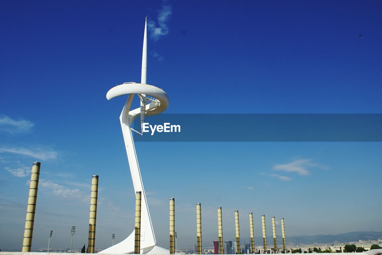 Low angle view of montjuic communications tower against sky