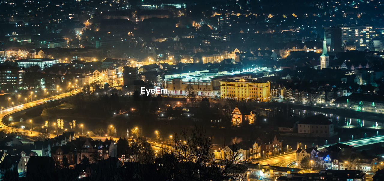 High angle view of illuminated buildings in city at night