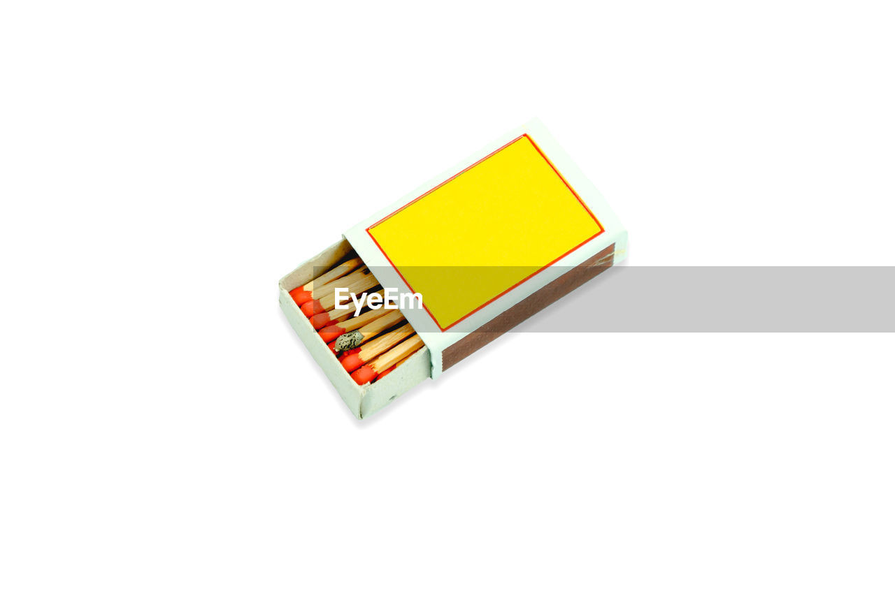 High angle view of matchbox on white background