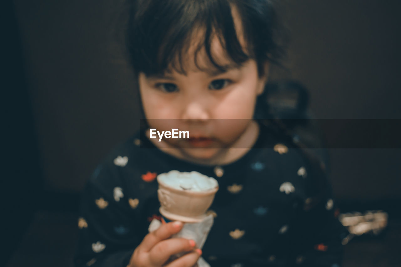 CLOSE-UP OF ICE CREAM CONE DURING HALLOWEEN