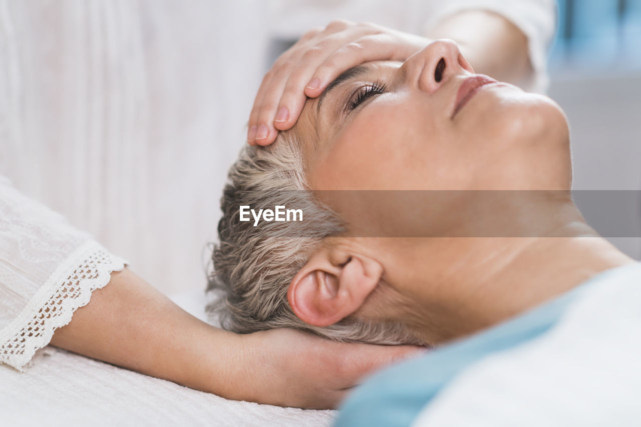 Close-up of woman getting massage at spa