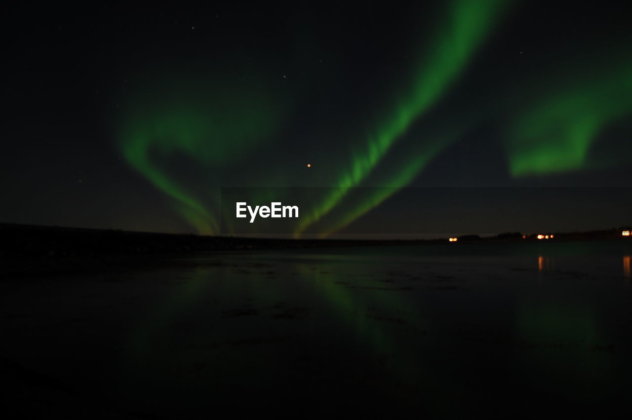 View of beach against sky at night