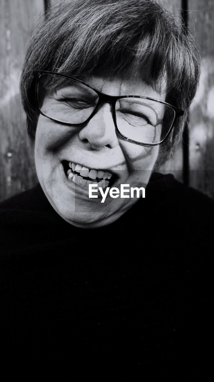 Close-up portrait of smiling mature woman