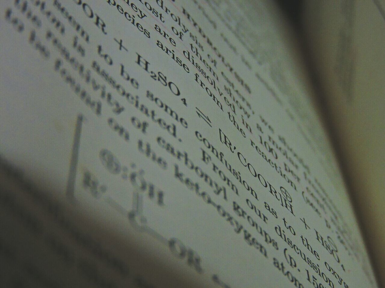 CLOSE-UP OF TEXT WRITTEN ON PAPER WITH PAPERS