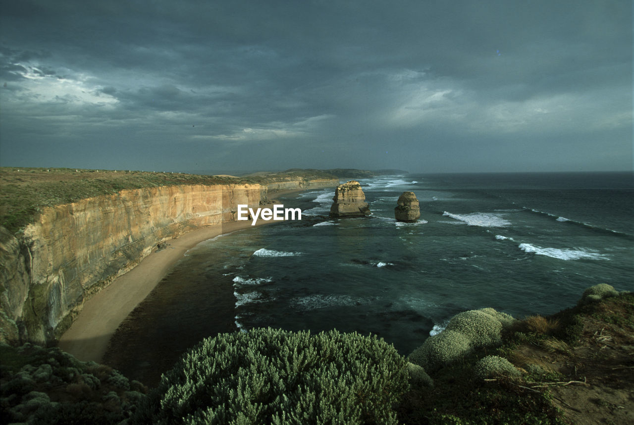 SCENIC VIEW OF SEA AND ROCKS AGAINST SKY