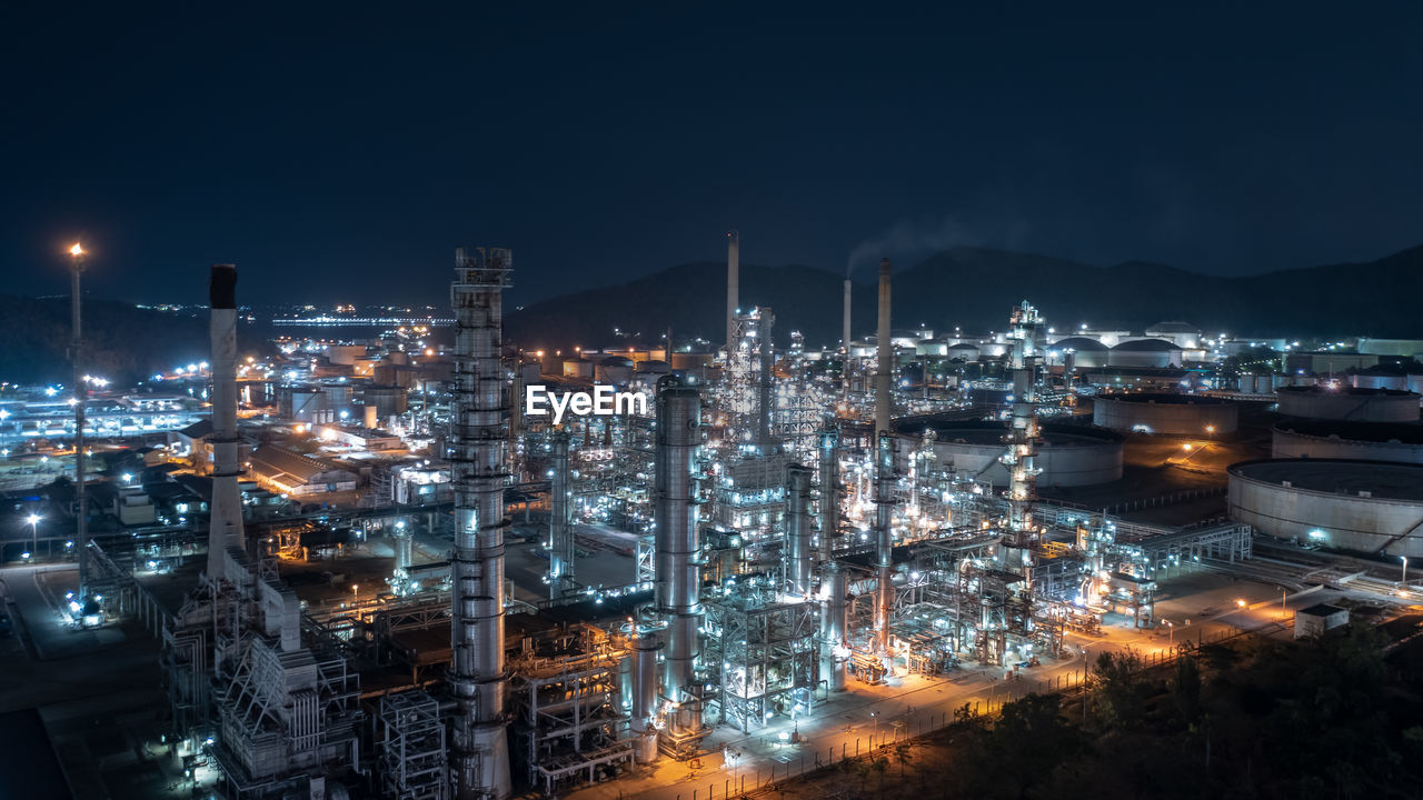  chemical industry storage tank and oil refinery in industrial plant at night over lighting, fuel 