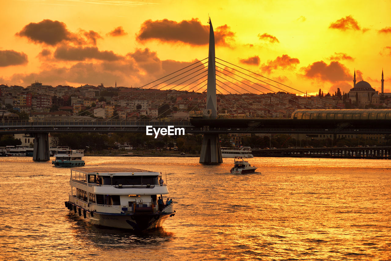 View of bridge over river against sky during sunset