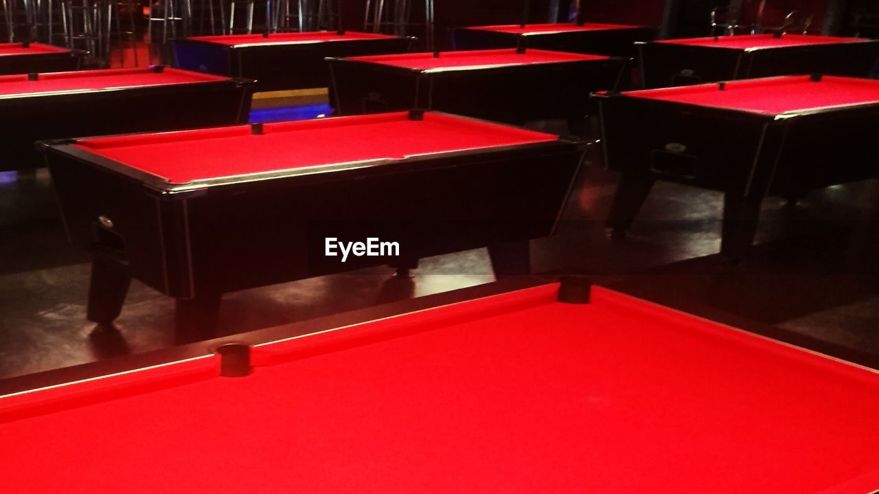 Empty red pool table at hall