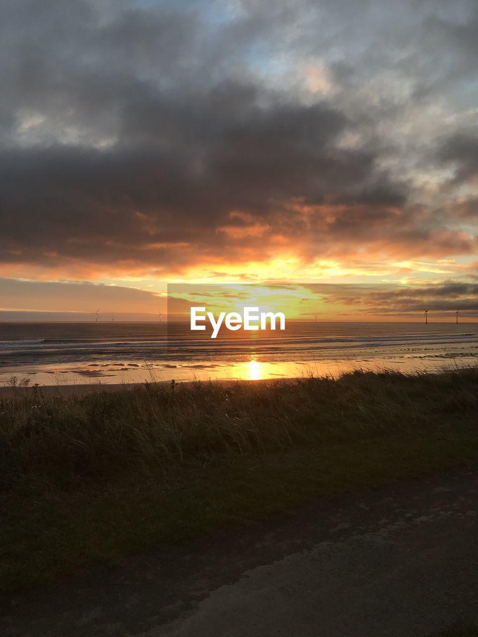 SCENIC VIEW OF SUNSET OVER SEA