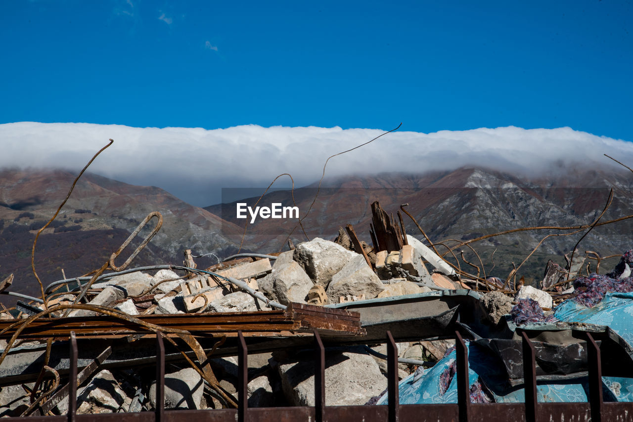 VIEW OF MOUNTAINS AGAINST BLUE SKY