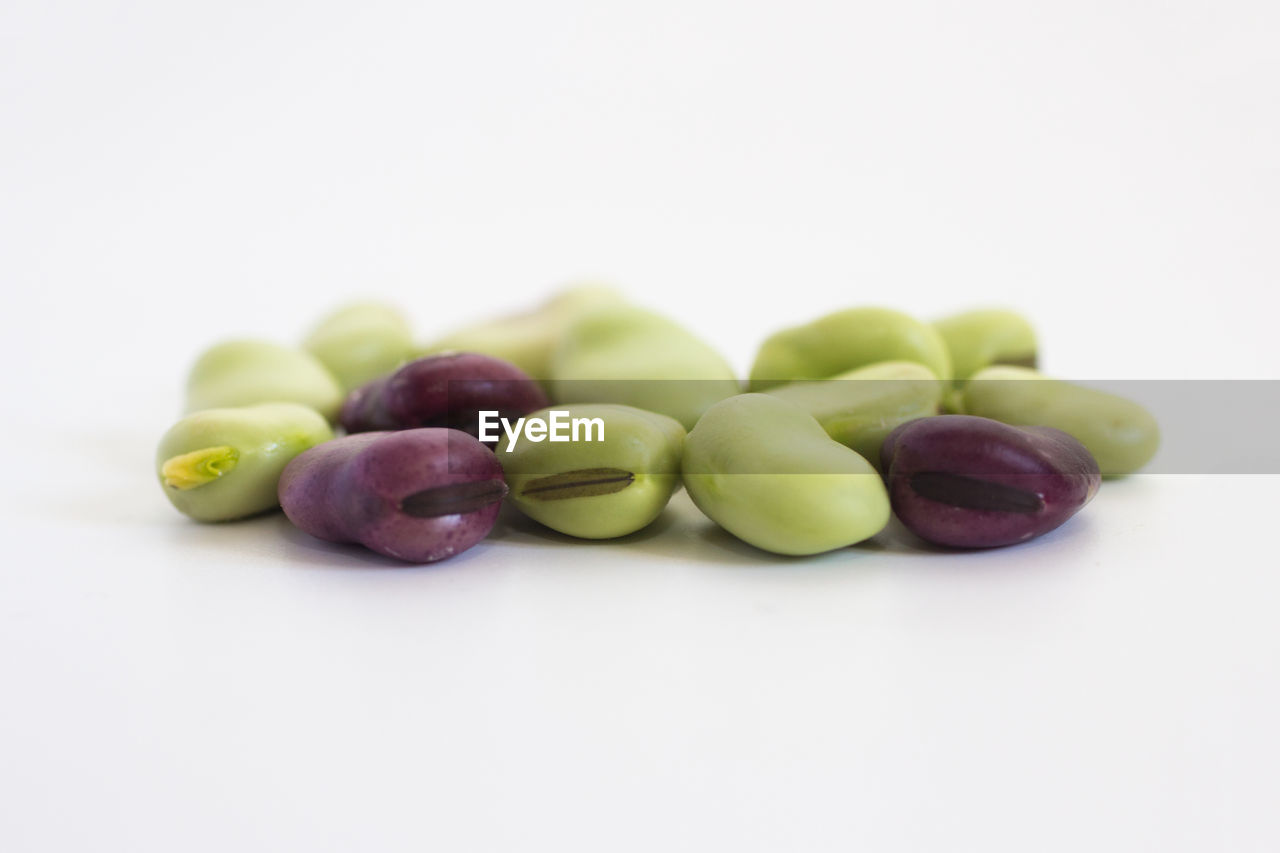 Broad beans on white background
